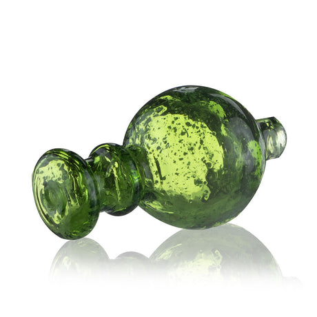 Side view of Fat Ass Glass green glow in the dark carb cap showing rounded glass body, airflow stem, and speckled detail