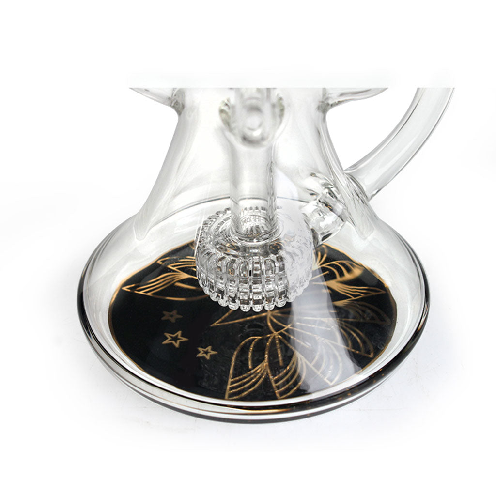 Base closeup of Phoenix Star 9 inch recycler oil rig showing showerhead perc and black disc with gold stars and leaf design