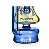 Base and logo detail of the blue Phoenix Star silver fumed Puffco Peak Pro recycler, a premium glass top for sale at Fat Ass Glass.