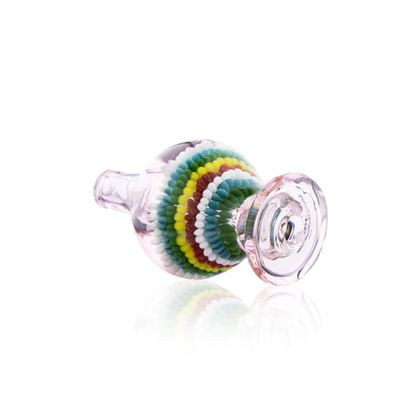 Pink artistic glass carb cap with multi-colored bead pattern shown from side angle for Fat Ass Glass
